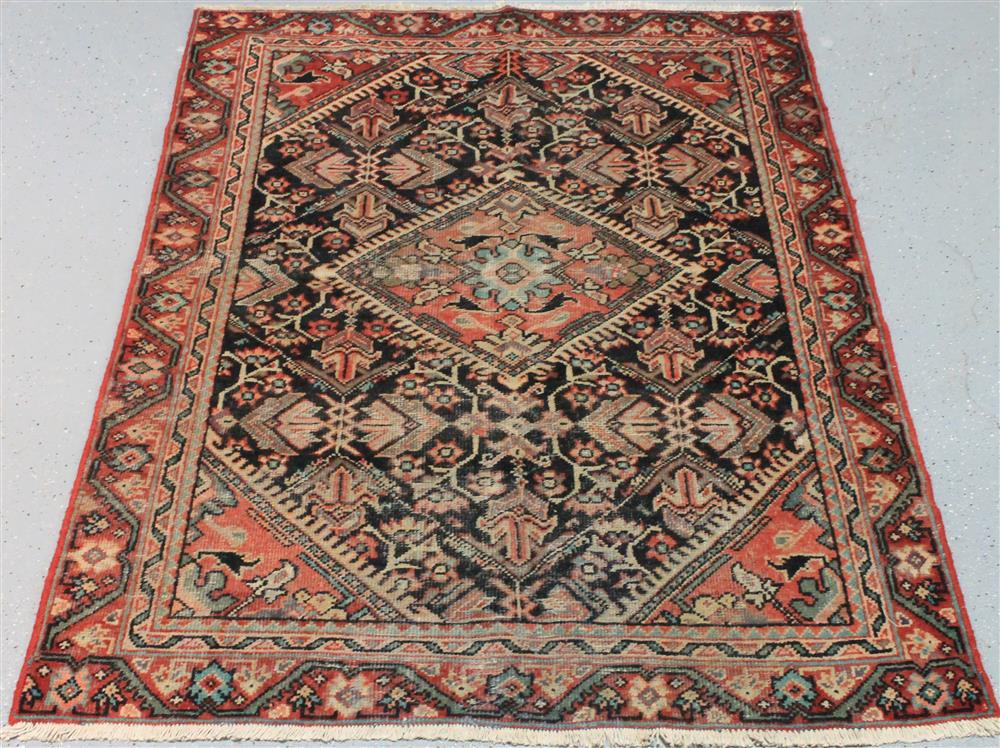 Appraisal: PERSIAN RUG having a blue ground with central medallion corner