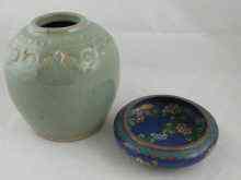 Appraisal: A Chinese celadon glazed jar with raised decoration cm diameter