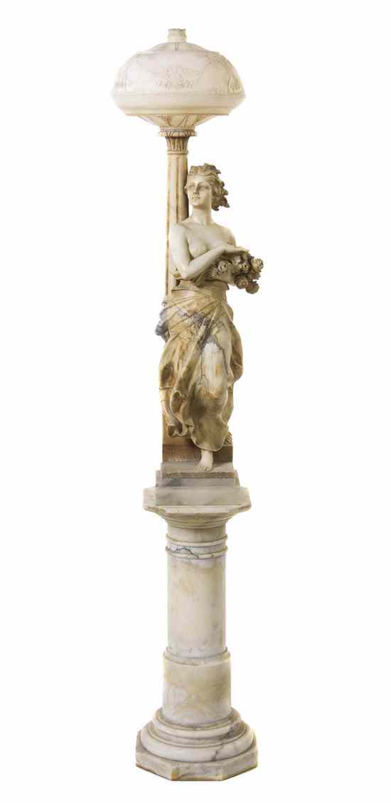 Appraisal: An Italian Carved Marble Figural Newel Post Lamp Scheggi depicting