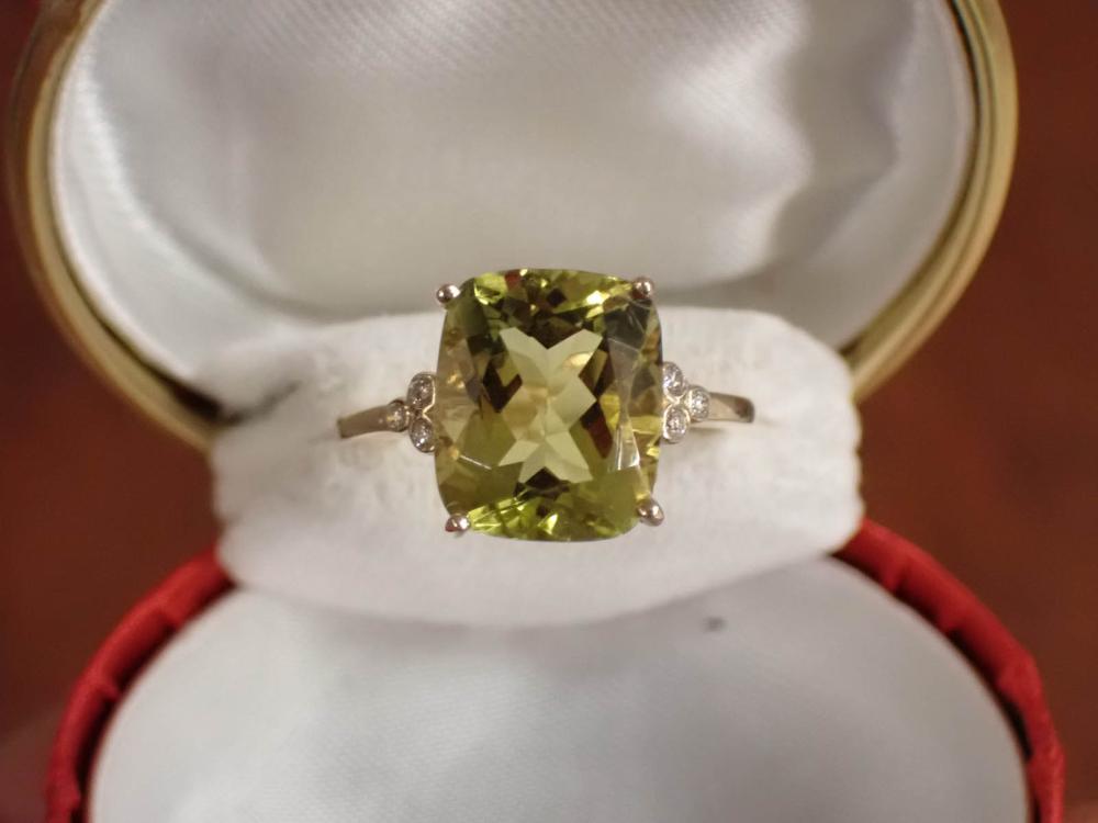 Appraisal: LEMON QUARTZ DIAMOND AND FOURTEEN KARAT YELLOW GOLD RING with