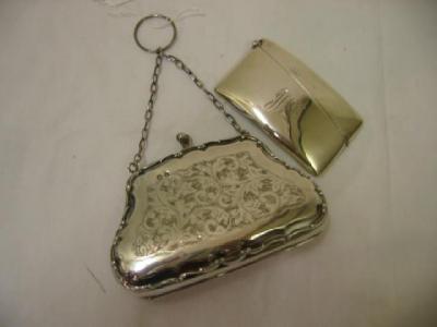 Appraisal: A PURSE of bellied form with chain handle chased with