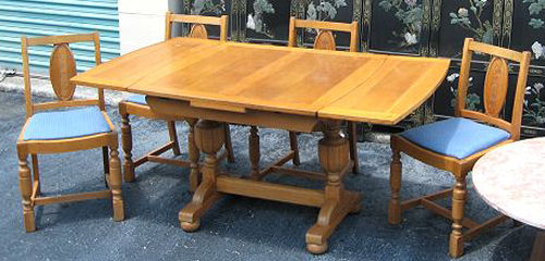 Appraisal: CLASSIC ENGLISH OAK PUB OR TAVERN TABLE CHAIRS Draw leaf