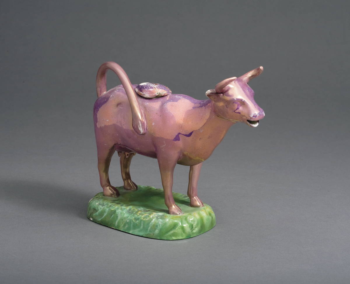 Appraisal: SWANSEA PINK LUSTRE COW CREAMER AND A COVER CIRCA -