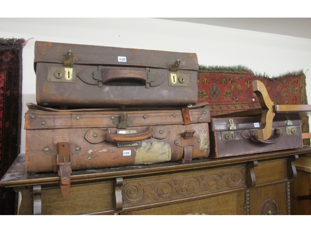 Appraisal: Firescreen and three assorted travel suitcases