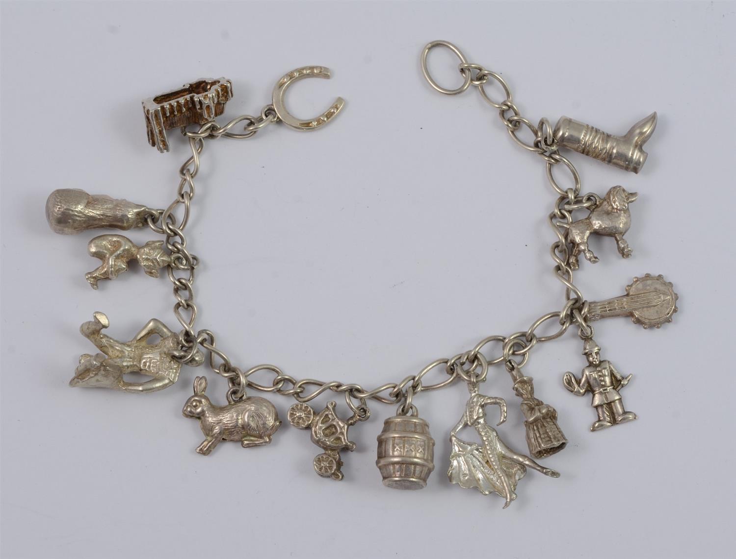 Appraisal: Sterling silver charm bracelet charms some unmarked TO