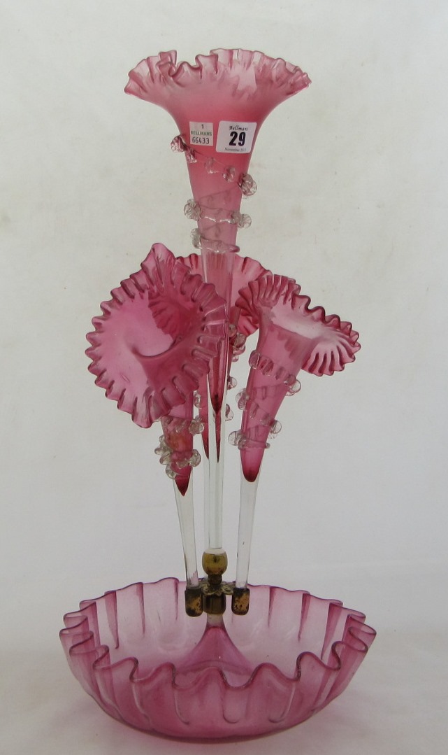 Appraisal: A late th century cranberry glass epergne cm high