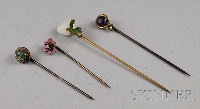 Appraisal: Four Antique Stickpins a kt gold and green stone pin