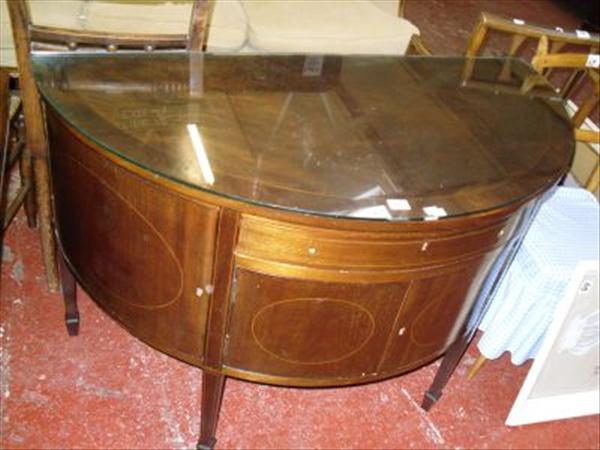 Appraisal: A th century mahogany demi lune sideboard on square tapering