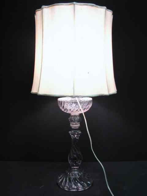 Appraisal: A large French mold-blown swirled glass kerosene lamp now wired