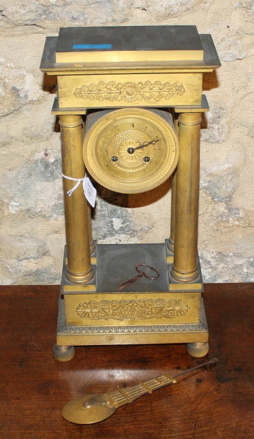 Appraisal: A FRENCH ORMOLU MANTEL CLOCK with cylindrical drum striking movement