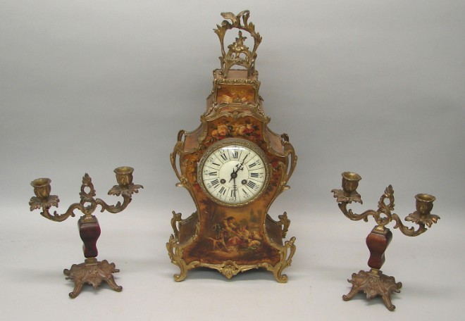 Appraisal: Clock features floral motif with scene depicting two figures in