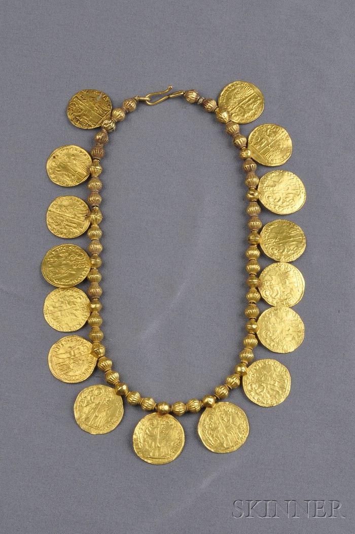 Appraisal: High Karat Gold Coin Necklace composed of fluted gold beads