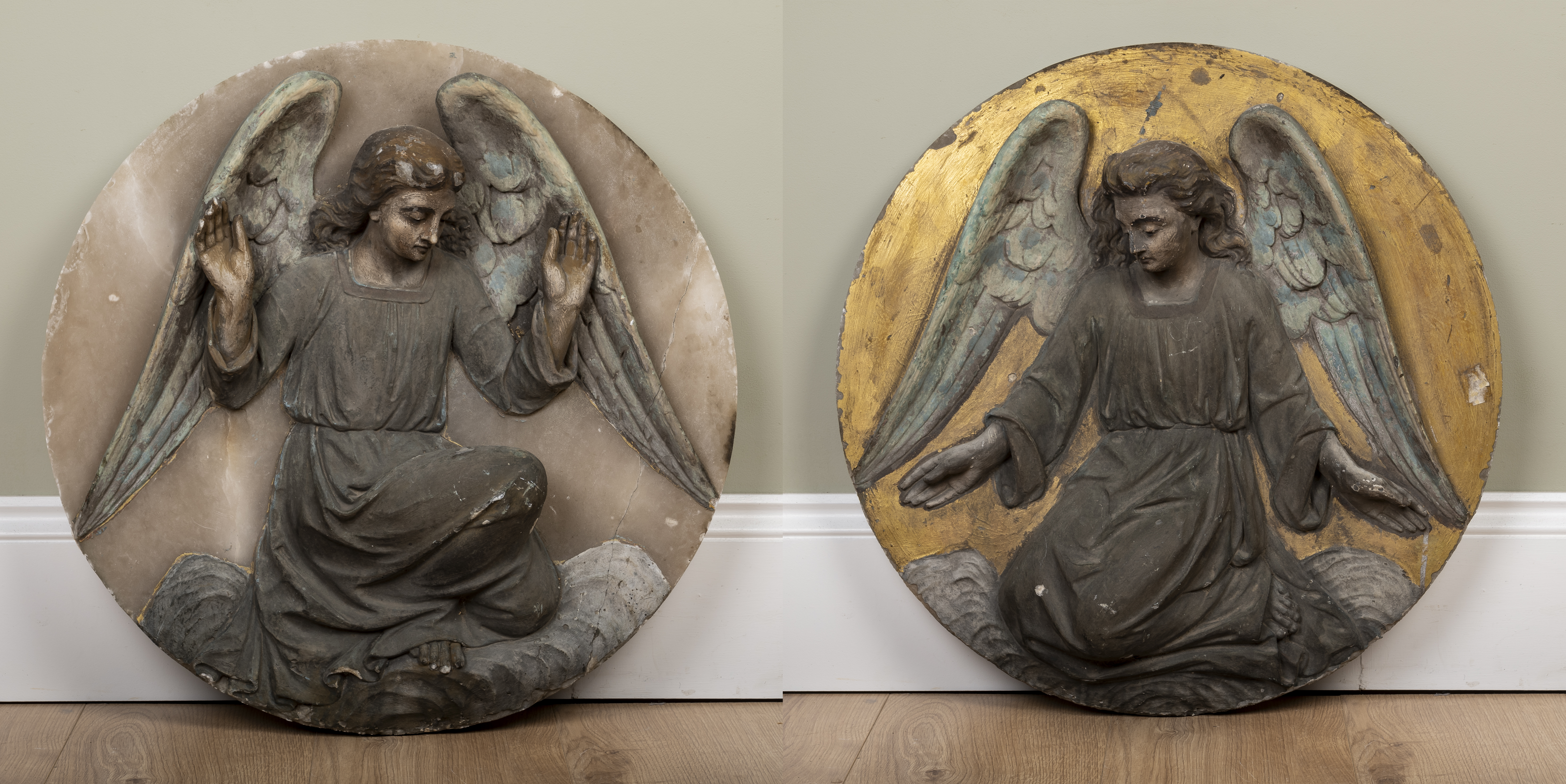 Appraisal: A pair of carved alabaster roundels depicting angels one on