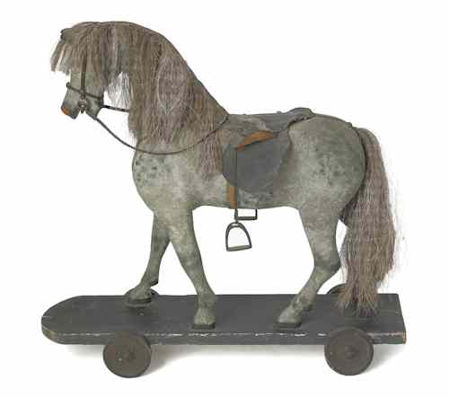 Appraisal: Carved and painted horse riding toy th c h w