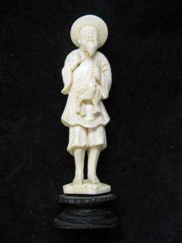 Appraisal: Carved Ivory Figurine of a Fisherman old man with his