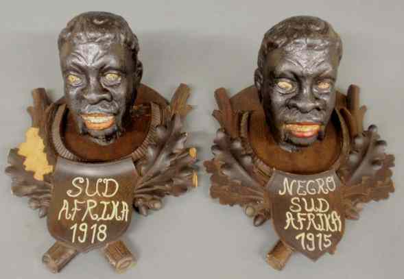 Appraisal: Pair of carved Black Forest African heads titled Sud Afrika