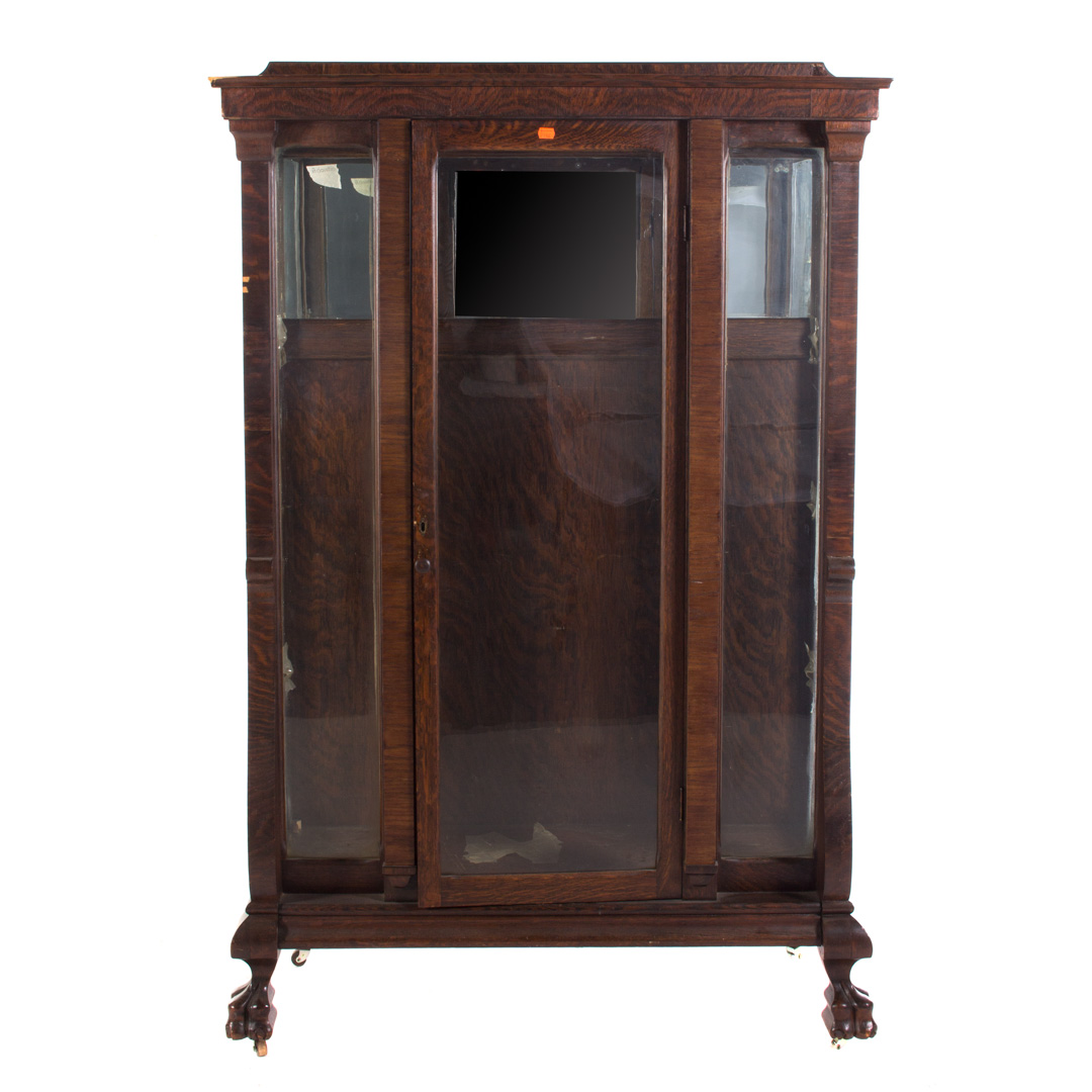 Appraisal: Victorian oak and glass panel china cabinet single door in