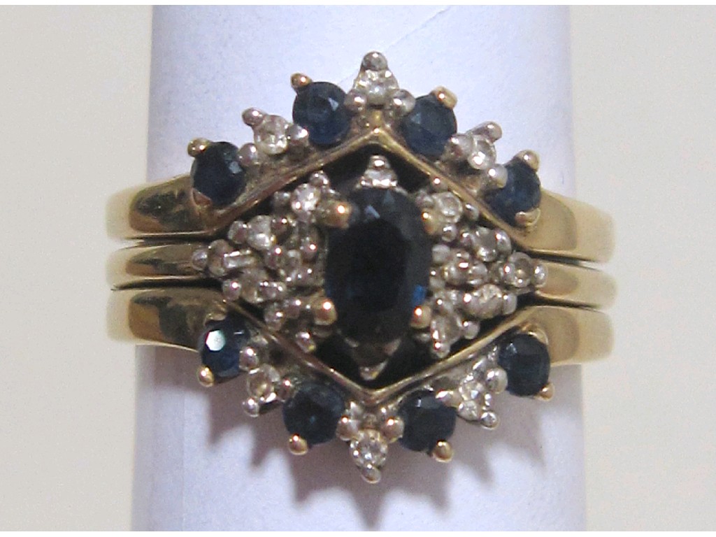 Appraisal: Nine carat gold sapphire and diamond trilogy ring