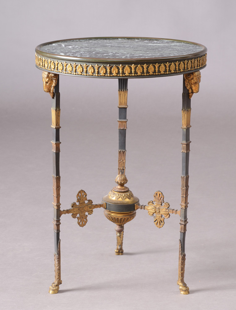 Appraisal: EMPIRE STYLE ORMOLU- MOUNTED METAL GU RIDON With an inset