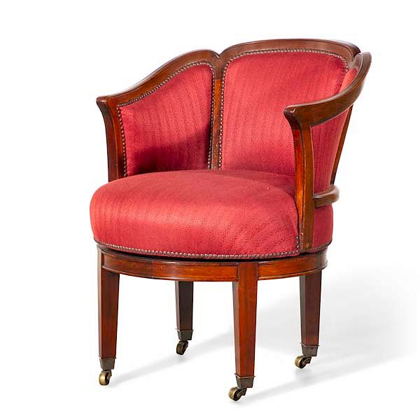 Appraisal: Neoclassical mahogany revolving library armchair A Continental Neoclassical mahogany revolving