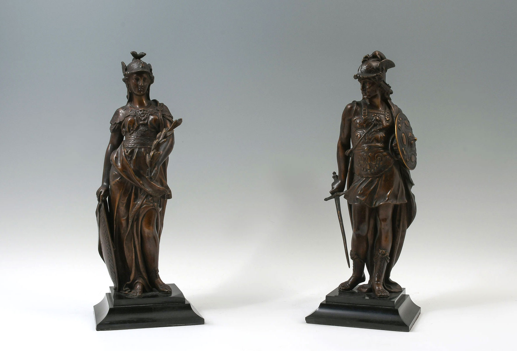 Appraisal: FINELY CAST BRONZE FIGURES OF WAR AND PEACE Male Figure