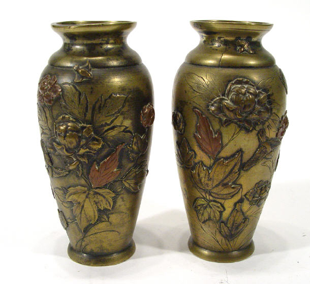 Appraisal: Pair of Oriental bronze vases cast with birds amongst peony