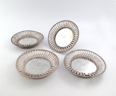 Appraisal: A set of four George III silver wine coasters by