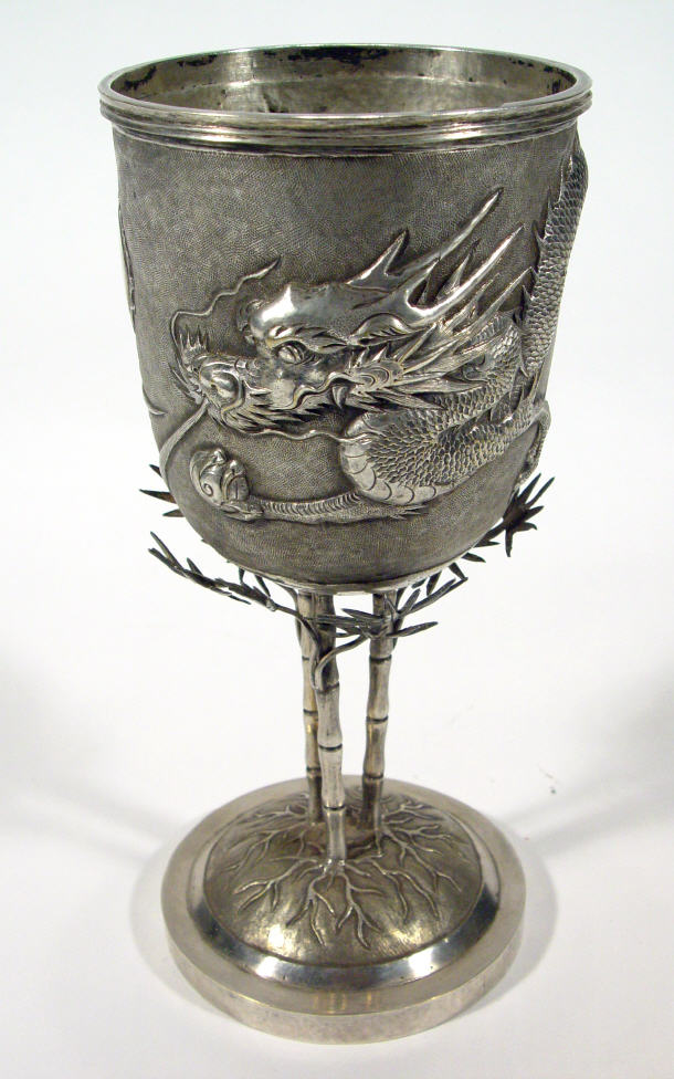 Appraisal: Chinese silver goblet the bowl embossed with a continuous dragon