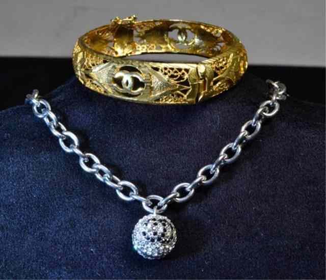 Appraisal: Ladies Chanel BraceletsTo include a gold tone open filigree bangle