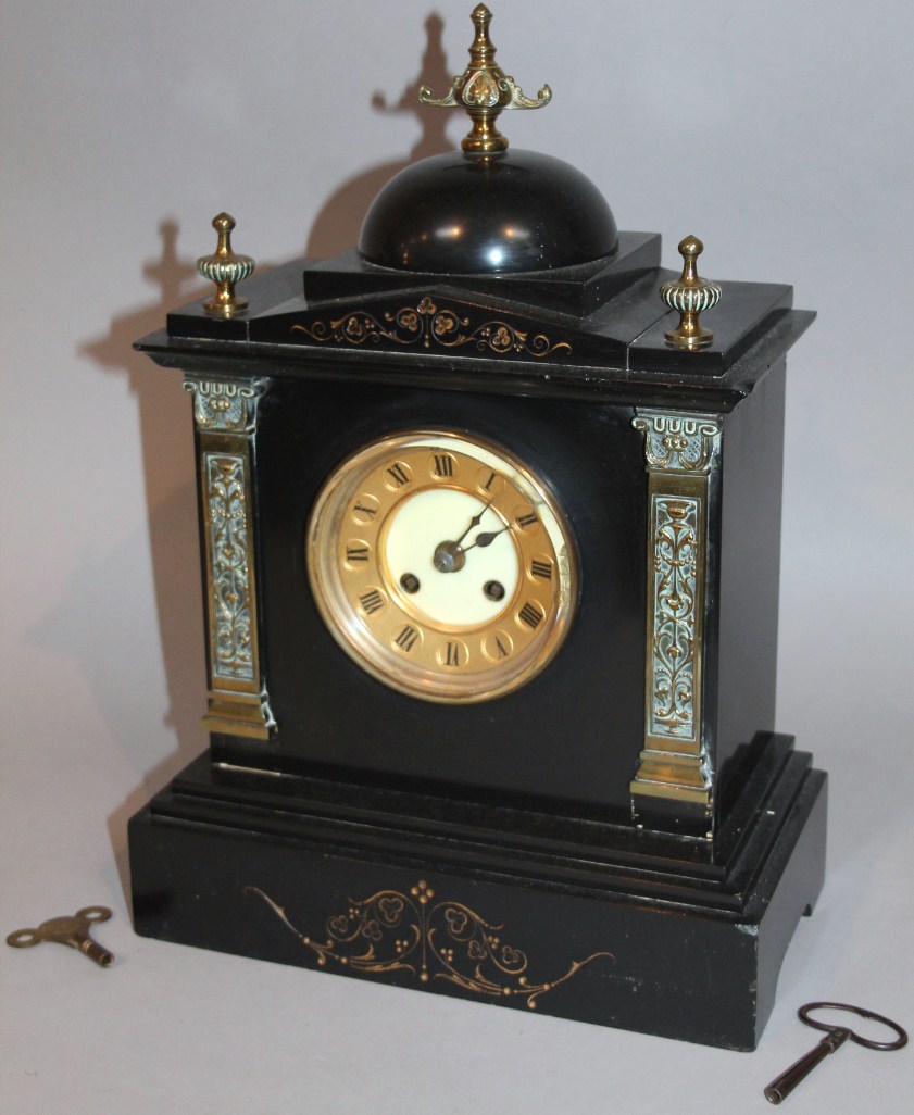 Appraisal: A Victorian black slate mantel clock of architectural design with