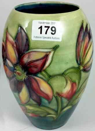 Appraisal: Moorcroft Lily Vase on a Blue Green Background height approx