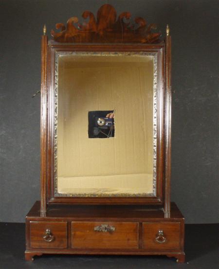 Appraisal: A George II mahogany dressing mirror the mirror surmounted by