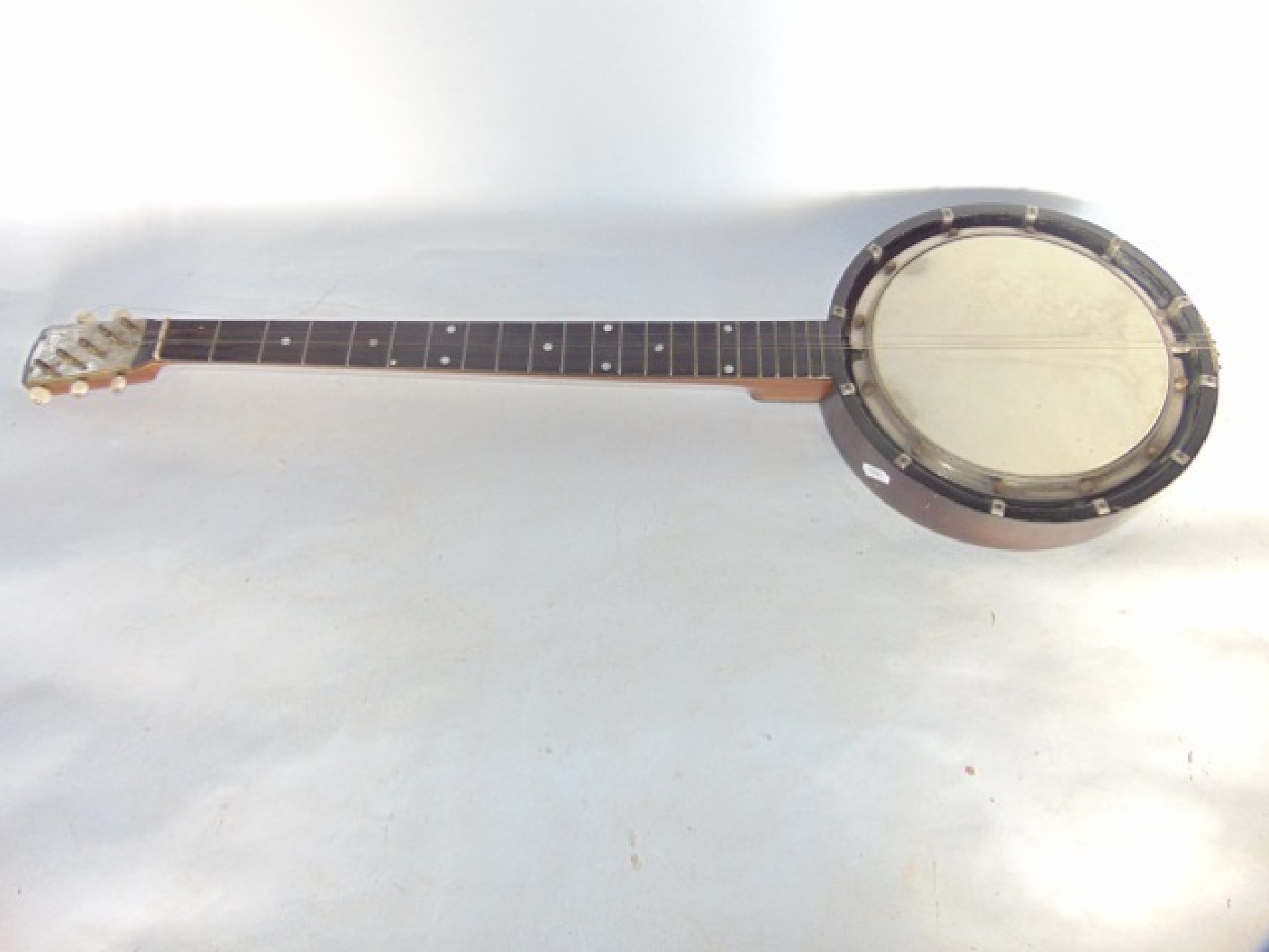 Appraisal: A five string Zither banjo with stamped detail to bridge