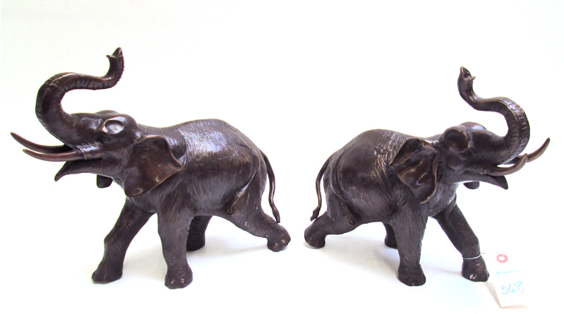 Appraisal: PAIR BRONZE ELEPHANTS in opposing positions Heights and inches