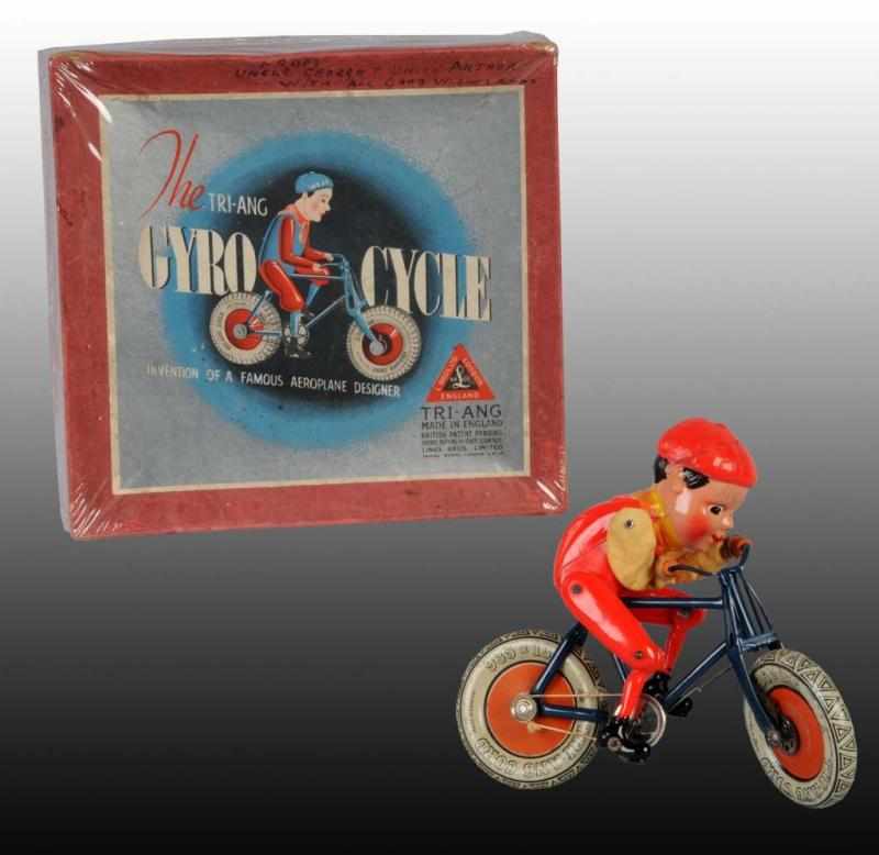 Appraisal: Tin Celluloid Tri-ang Gyro Cycle Toy Description English Working Unusual