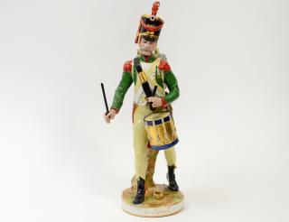 Appraisal: PORCELAIN FIGURE OF A FRENCH SOLDIER DRUMMER Titled Le Reveil