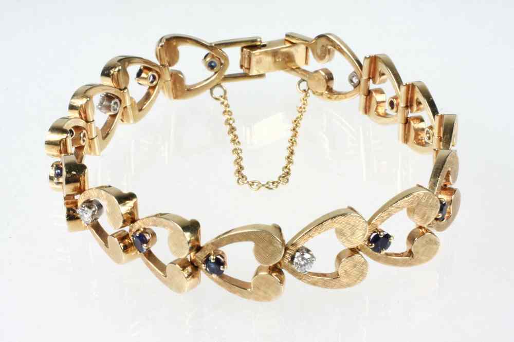 Appraisal: BRACELET - One K yellow gold sapphire and diamond link