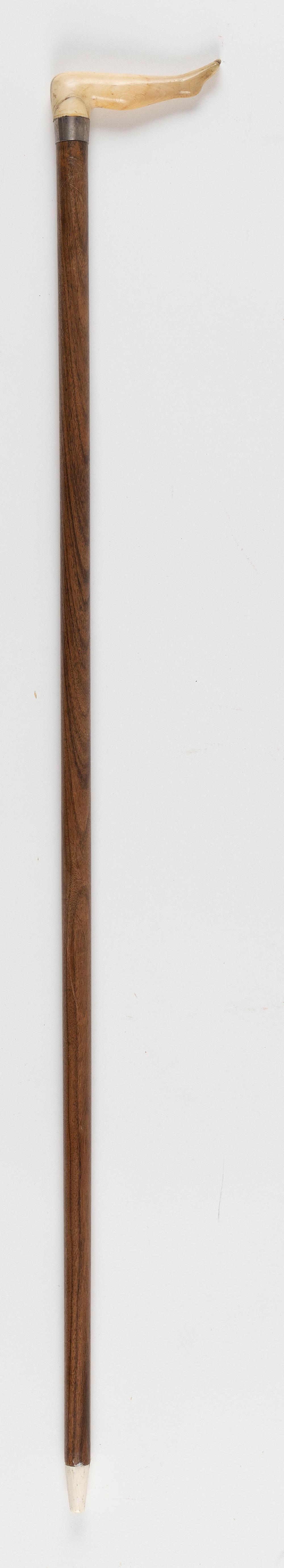 Appraisal: CANE WITH A NAUGHTY NELLIE HANDLE TH CENTURY LENGTH CANE