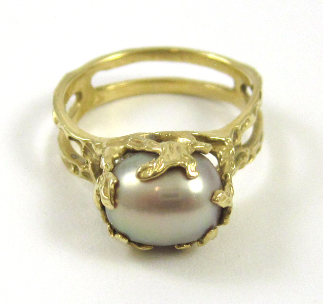 Appraisal: GREY PEARL AND FOURTEEN KARAT GOLD RING set with a