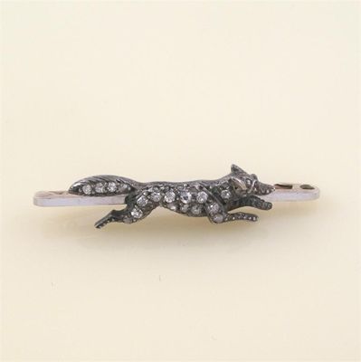 Appraisal: A late Victorian Edwardian running fox bar brooch the fox