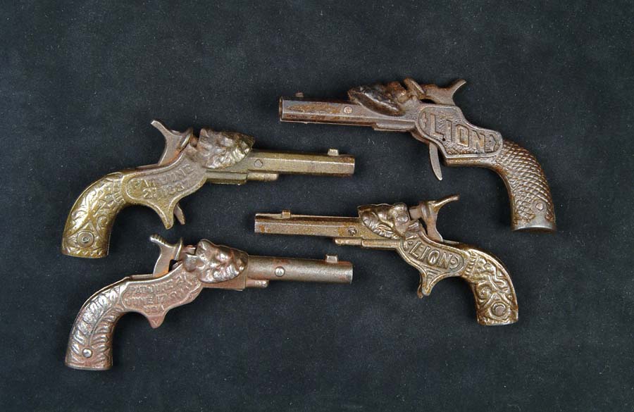 Appraisal: LOT OF FOUR LION HEAD CAP GUNS L - -