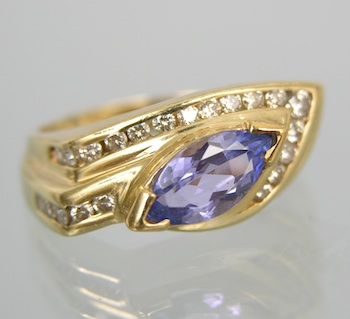 Appraisal: A Contemporary Tanzanite and Diamond Ring k yellow gold ring