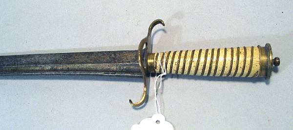 Appraisal: A brass-hilted hangerpossibly American Slightly curved inch blade with deep