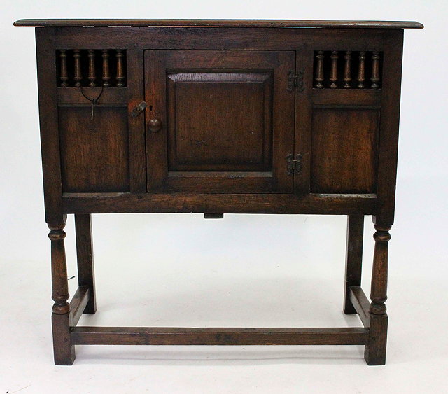 Appraisal: AN OAK TH CENTURY STYLE COURT CUPBOARD with panelled front