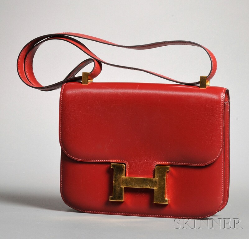 Appraisal: Burgundy Leather Constance Handbag Hermes the rigid leather form with