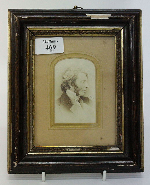 Appraisal: A VICTORIAN CABINET PHOTOGRAPH depicting John Ruskin in an associated