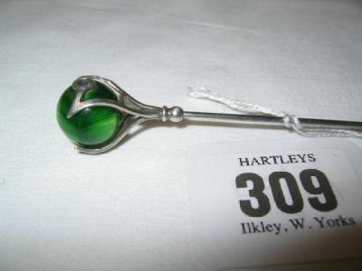 Appraisal: A CHARLES HORNER SILVER HAT PIN comprising a green glass