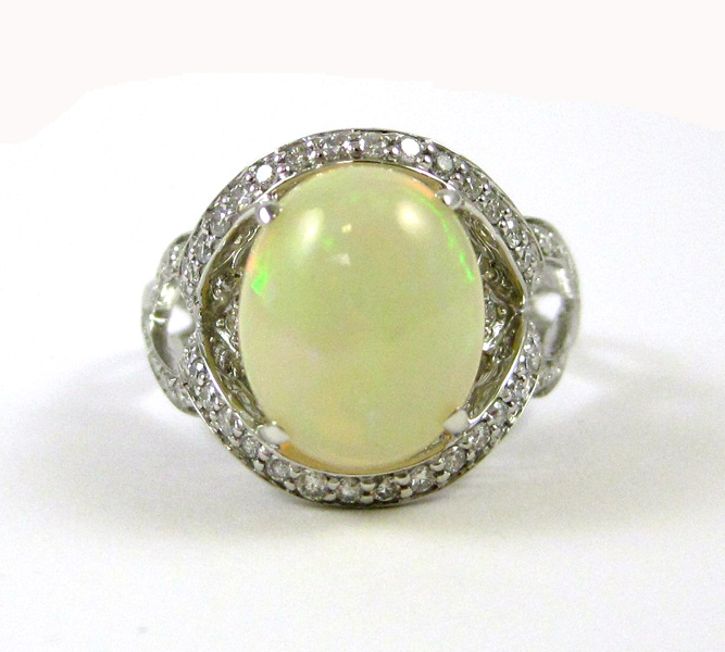 Appraisal: OPAL DIAMOND AND FOURTEEN KARAT GOLD RING The white gold