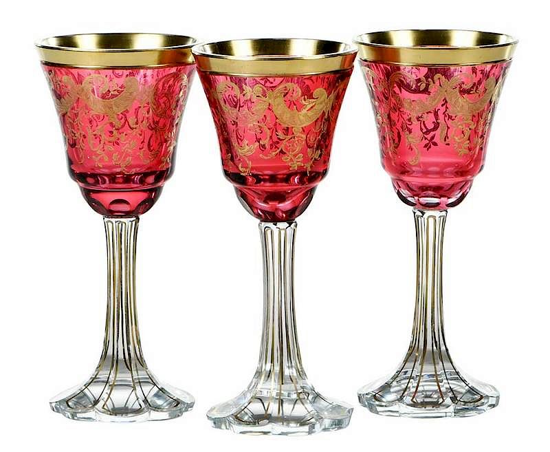 Appraisal: Bohemian Gilt Cranberry Wine Goblets circa petal form clear bases