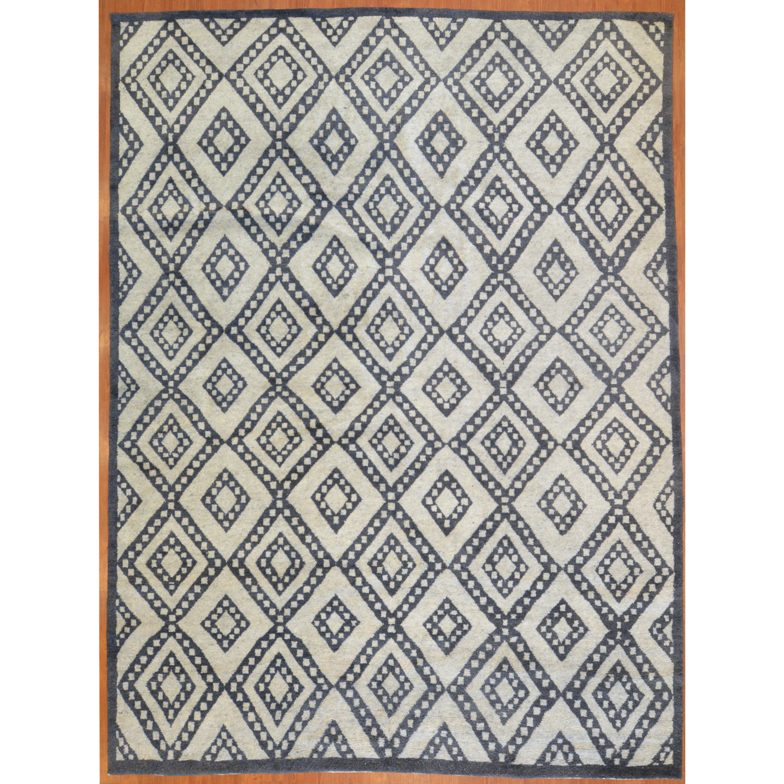 Appraisal: MODERN GEOMETRIC PATTERN CARPET INDIA X Modern hand-knotted wool pile